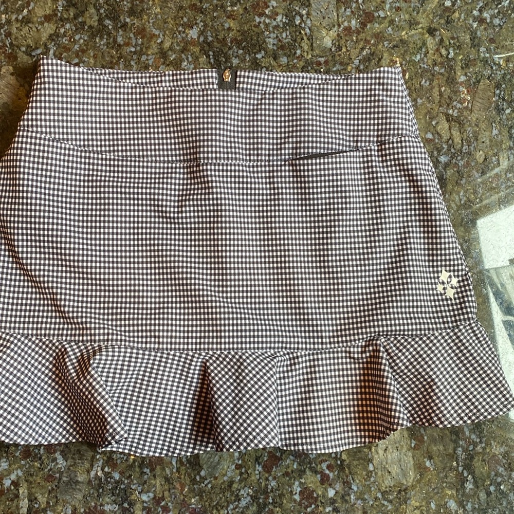 JOFIT CLUB SKORT SIZE 2, cute with zipper, black and white. Like new.